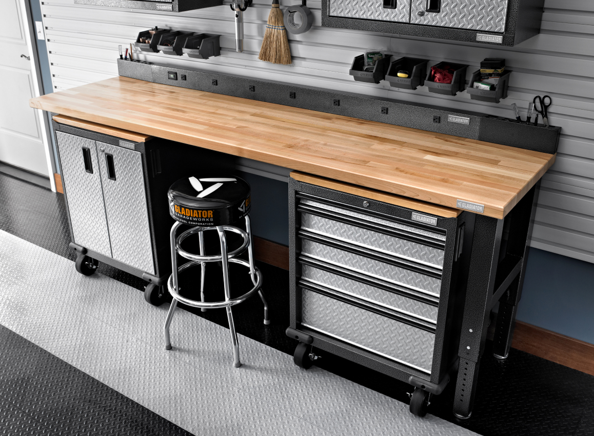 A stool in front of a Gladiator Workbench. Gladiator Bins are in front of it. Above is a Gladiator Cabinet.