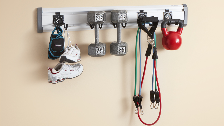 On a Gladiator GearTrack are two weights, shoes, a kettlebell, and resistance bands.