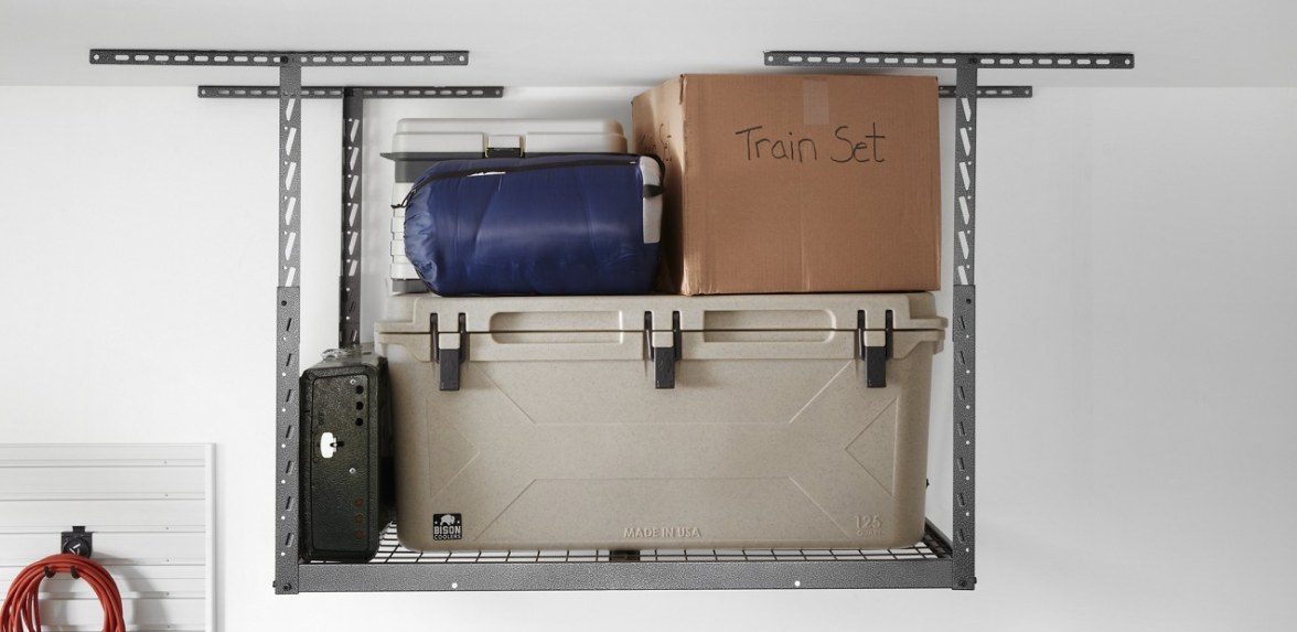A Gladiator Overhead Storage with lumber, bins, boxes, bags and two stacked canisters.