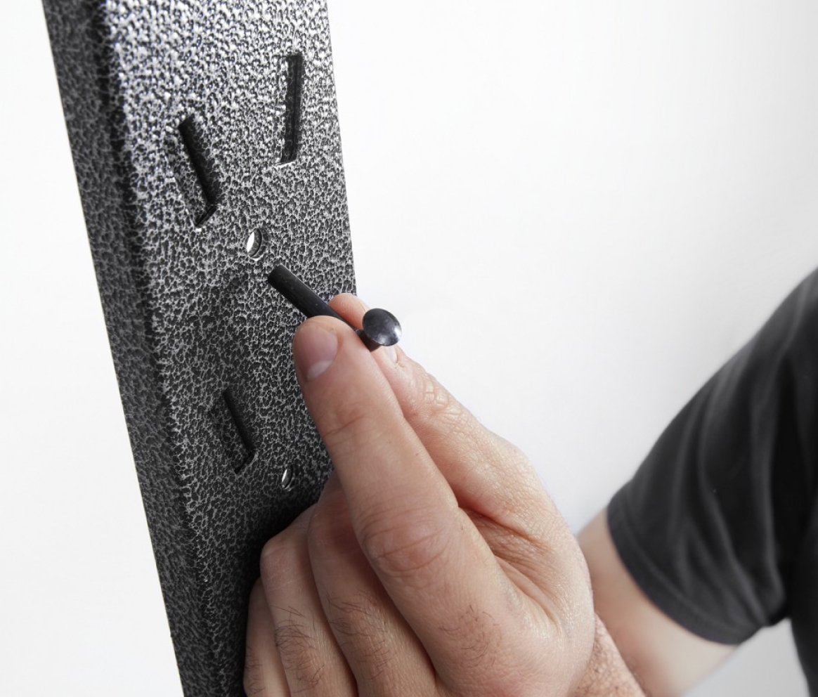 Someone is about to place a screw in a part.