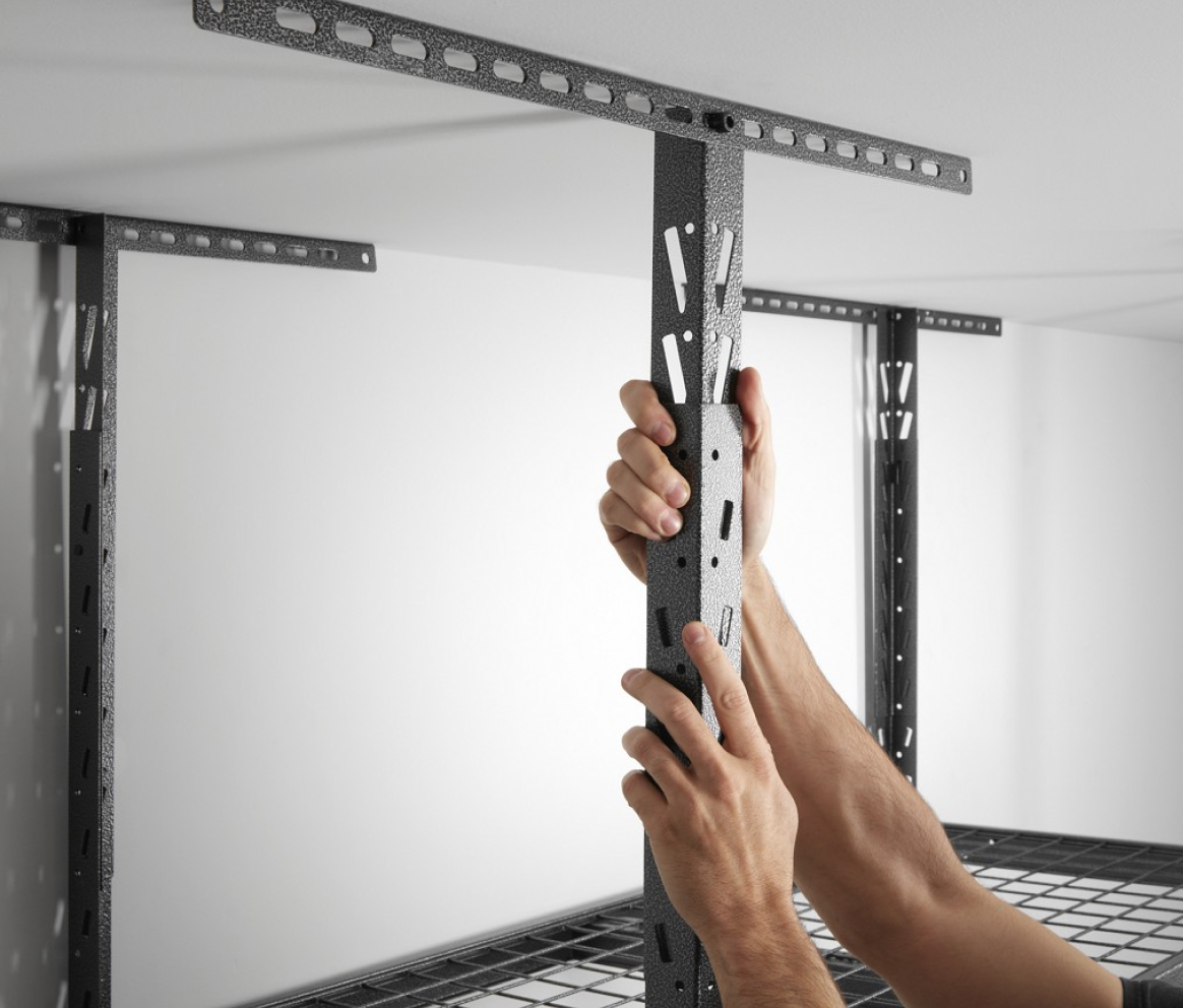 Someone assembles adjustable ceiling brackets as part of Gladiator's EZ Connect Technology.