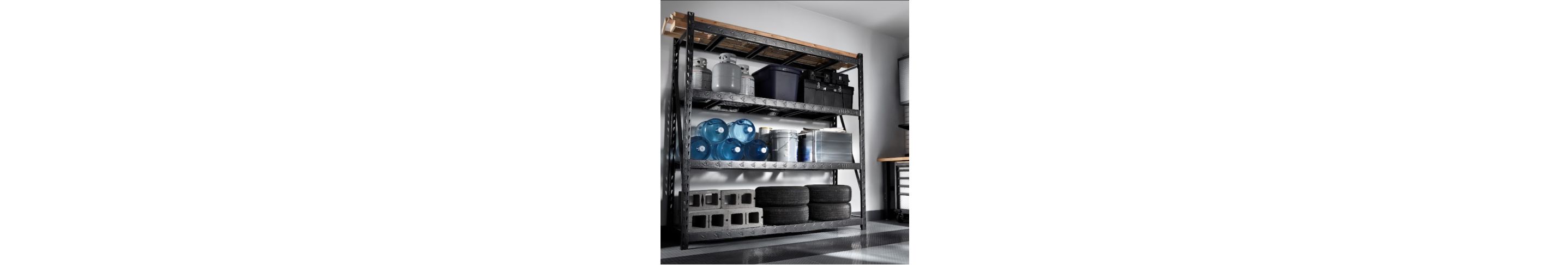 Rack Shelving with propane tanks and bins on the top shelf, water cooler jugs, a bucket and a bin on the middle shelf and cinder blocks and tires on the bottom shelf
