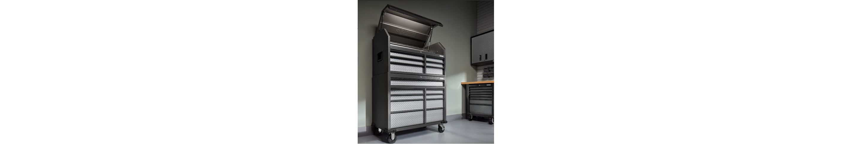 A Gladiator Tool Storage Unit with the top compartment opened. Next to it are Gladiator Cabinets